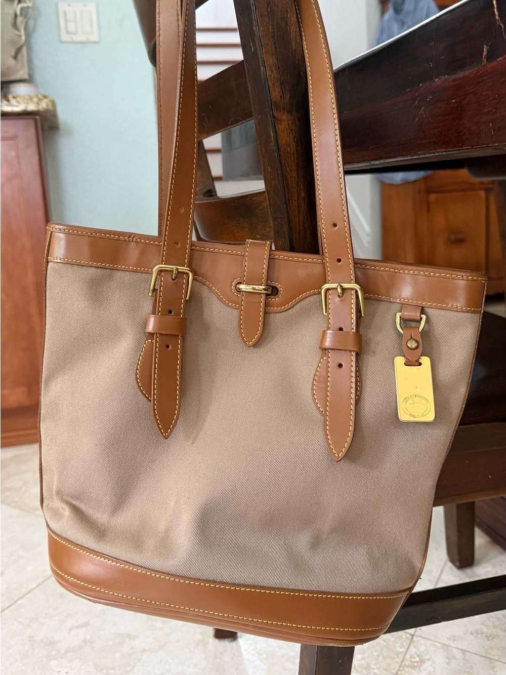 Dooney &Bourke vintage Cabriolet line. Taupe and beige fabric.